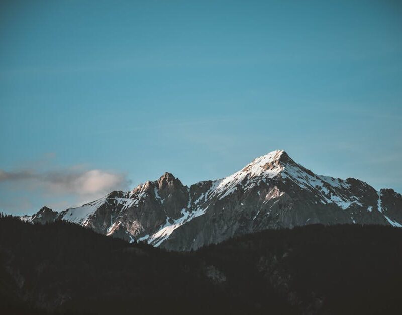 Mountain Landscapes - Stunning view of snow-capped mountains against a #1054218