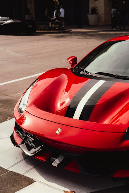 Luxury Cars - A gleaming red Ferrari with black stripes displa #10889192