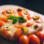 Food Aesthetics - Mouth-watering pizza topped with fresh basil, to #14373594