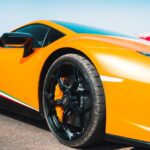 Luxury Cars - Close-up of a vibrant yellow luxury supercar on #14843602