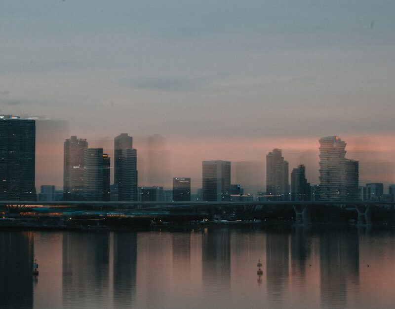 City Architecture - A moody cityscape of Singapore's skyline at dusk #18095416