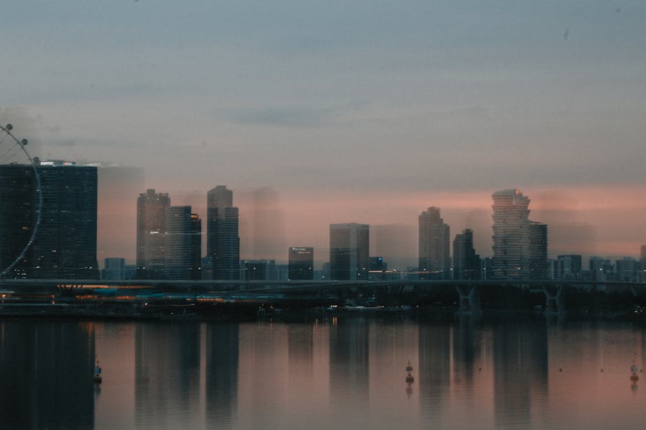 City Architecture - A moody cityscape of Singapore's skyline at dusk #18095416