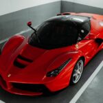Luxury Cars - A stunning red Ferrari supercar parked indoors,  #28868891