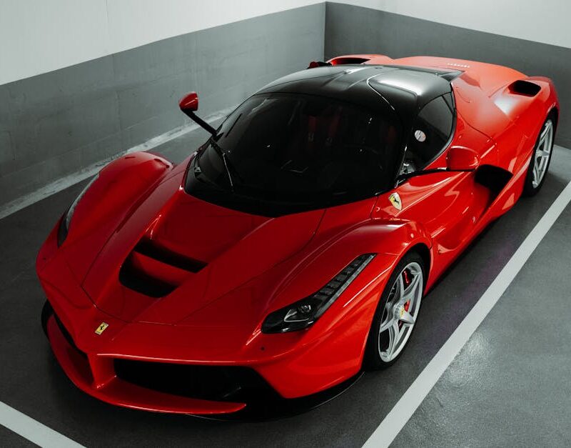 Luxury Cars - A stunning red Ferrari supercar parked indoors, #28868891