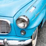 Luxury Cars - Close-up of a classic blue vintage car's headlig #32364013