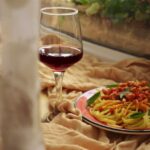 Food Aesthetics - A plate of spaghetti with tomato sauce and a gla #32801831