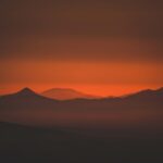 Mountain Landscapes - Captivating silhouette of mountains at sunset wi #32901654