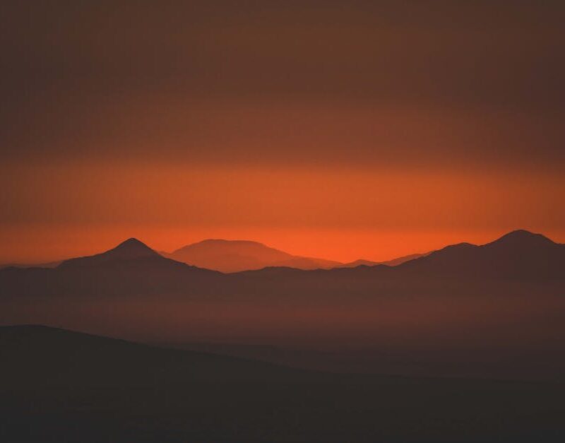 Mountain Landscapes - Captivating silhouette of mountains at sunset wi #32901654