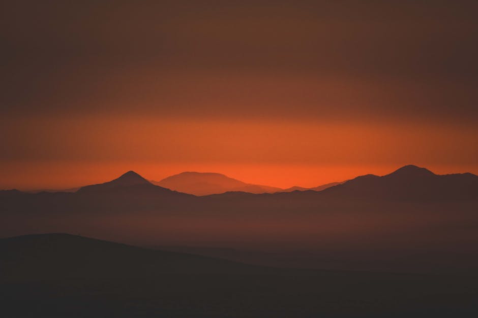 Mountain Landscapes - Captivating silhouette of mountains at sunset wi #32901654