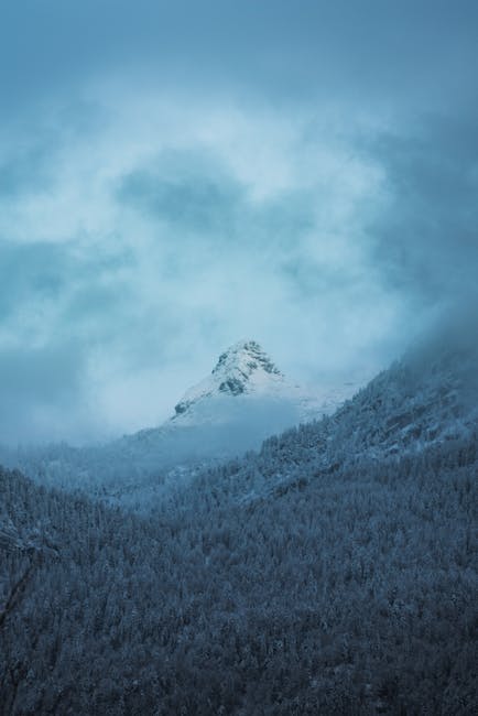 Mountain Landscapes - A scenic winter view of a snow-covered mountain  #35002221