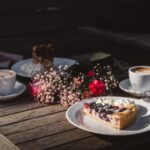 Food Aesthetics - A warm, inviting outdoor setup with coffee, berr #35121849