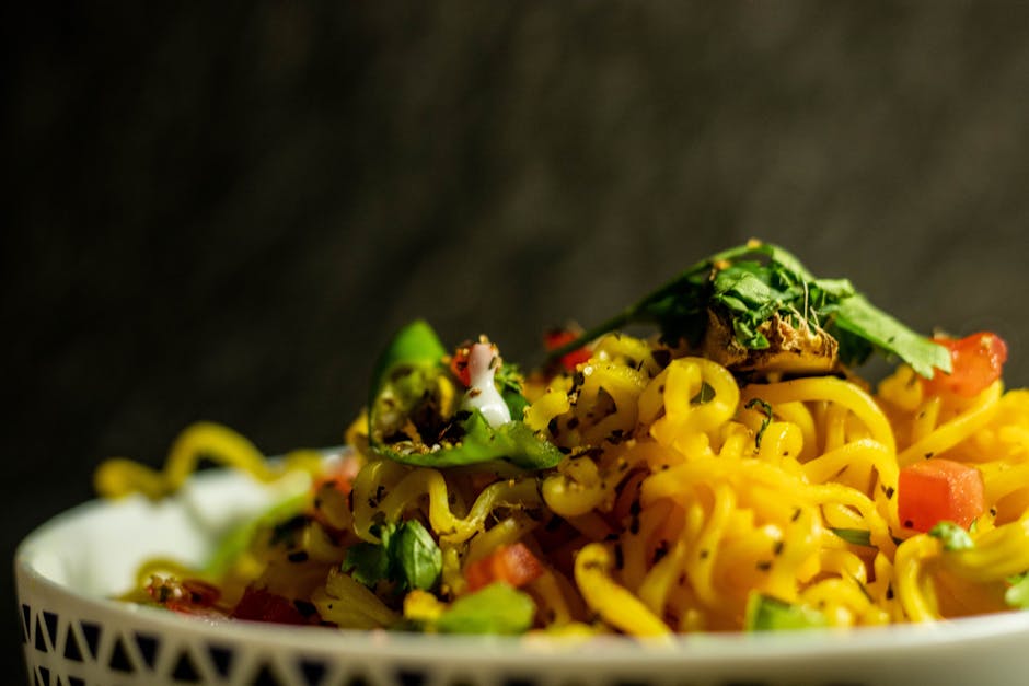 Food Aesthetics - Close-up of a vibrant Indian noodle dish garnish #4635600