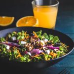 Food Aesthetics - A vibrant, healthy salad bowl with nuts and a gl #6896283
