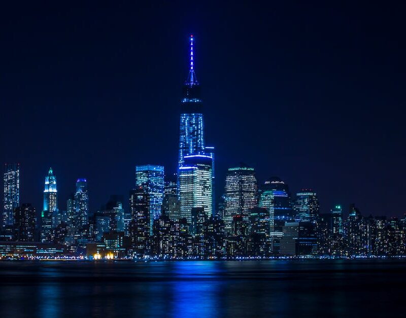 City Architecture - Illuminated New York City skyline reflecting ove #747101